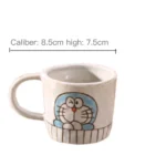 Japanese ceramic dinnerware set with hand-drawn cat design on blue rectangular plate and bowl
