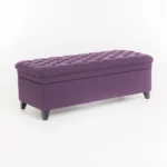 Purple fabric storage ottoman with hidden compartment and birch wood legs in a living room