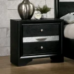 Contemporary black nightstand with hidden drawer and nickel knobs on a bedroom background