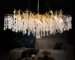 Modern crystal chandelier illuminating a stylish dining room