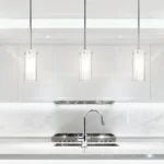 Single Nordic pendant light as a focal point above a small dining table.