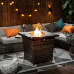 Square propane fire pit table with wicker base on patio