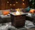 Square propane fire pit table with wicker base on patio