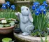 Solar rabbit statue glowing in garden at dusk