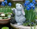 Solar rabbit statue glowing in garden at dusk