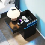 Modern black wooden nightstand with built-in charging station and LED lighting, featuring 3 drawers and sliding top
