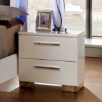 Glossy white nightstand with two drawers and chrome handles - contemporary bedroom furniture by Goldoma