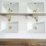 Open cabinet doors revealing storage space inside the double sink 48-inch maple floating bathroom vanity.