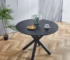 42-inch round mirrored dining table with matte black metal base in a modern dining room