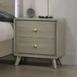 Modern nightstand with USB port and gold capped legs in bedroom setting