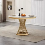 47-inch round marble dining table with stainless steel base in a modern luxury dining room setting
