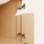 Vanity with soft close feature demonstrated, hand pushing drawer to show quiet closing.