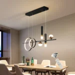 48W modern LED linear pendant light in black and gold, suspended over a kitchen island with stools