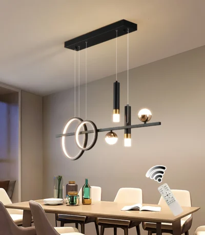 48W modern LED linear pendant light in black and gold, suspended over a kitchen island with stools
