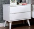 White mid century bedside table with two drawers in a modern bedroom setting