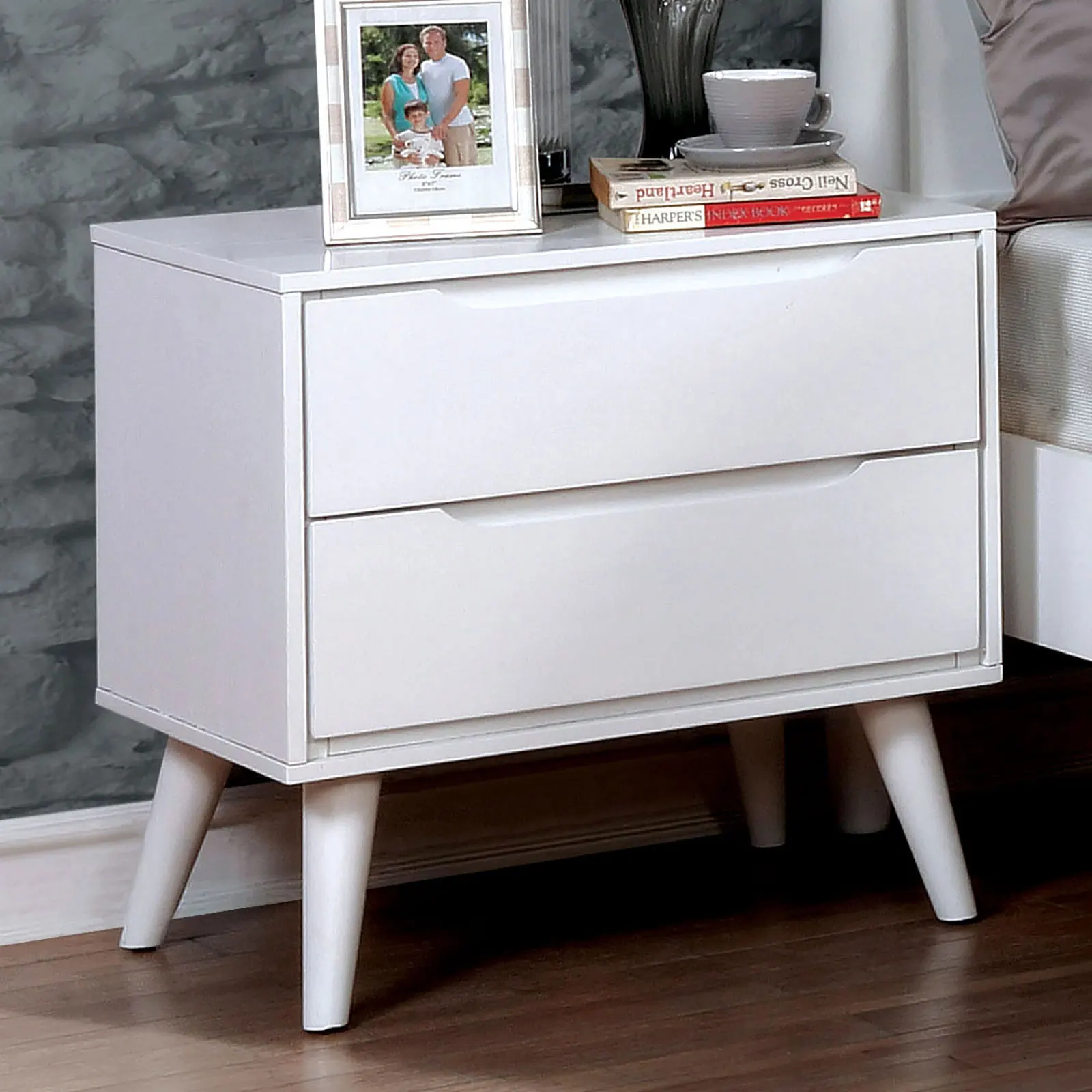 H18bba35408634bed9c2e900d395d4049q.webp Modern white nightstand with 2 drawers and tapered legs in a bedroom setting