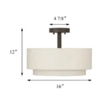 Detail shot of the top tier and mounting base of the fabric pendant light against a white ceiling.