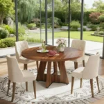 Modern round dining table with marble top and wood legs seating six in a living room