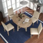 Farmhouse dining table set with extendable round solid wood table and four upholstered chairs in natural wood wash finish