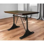 Goldoma 48 inch solid wood and iron trestle dining table with brown top and black base in a dining room setting