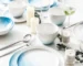 Nordic gradient blue ceramic dessert plates set with bowls and cups on a wooden table