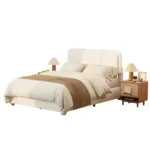 Goldoma queen bed frame with adjustable height headboard and curved cloud boucle upholstery in a modern bedroom setting