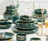 Luxury dinnerware set green porcelain with gold inlay on dining table