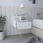White floating nightstand with one drawer wall mounted in a modern bedroom