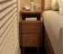 Modern solid walnut nightstand with two drawers in a bedroom setting