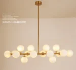 Close-up of the Magic Bean glass pendant light, showing the white spherical glass shades and metallic top.