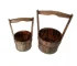 Pair of large outdoor planters with thriving plants on a sunny patio