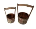 Pair of large outdoor planters with thriving plants on a sunny patio