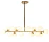 Modern white bubble chandelier with LED lights hanging above a dining table in a bright living room.