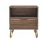 Brown nightstand with gold legs featuring a drawer and open shelf in a modern bedroom