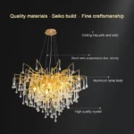 Modern gold chandelier with crystal branches illuminating a dining room