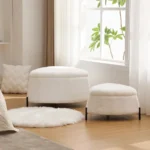 White faux fur storage ottoman set of 2 with metal legs placed in bedroom as footrest and shoe changing stool