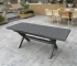 Modern patio dining set with aluminum table and four chairs on a deck