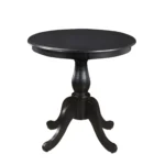 30 inch round dining table with black pedestal base in a modern dining room