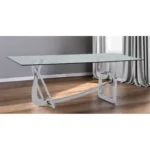 79-inch clear glass dining table with silver stainless steel trestle base in a modern dining room