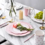 Elegant gold rim dinner plates with floral shape on a dining table