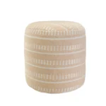 Goldoma 20 inch brown striped polyester pouf ottoman used as a footrest in a cozy living room setting