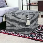 Goldoma 18-inch gray cotton striped pouf ottoman with modern tufted design in living room