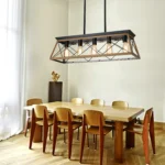 Goldoma 5-light chandelier with adjustable hanging rods, set at different heights in a living room corner.