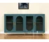 Teal blue mango wood sideboard with four doors and ribbed texture in a modern dining room