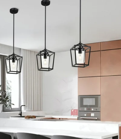 Black cage pendant light hanging from ceiling in a modern restaurant setting with warm ambient lighting.