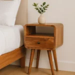 Solid oak mini nightstand with drawer and open shelf in brown finish, perfect for small bedrooms
