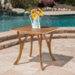 Acacia wood outdoor dining table square 31.5 inch natural brown finish on patio