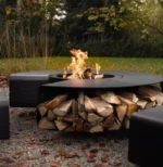 Outdoor fire pit chimnea on patio with flames and grill grate