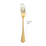 Elegant gold flatware set with fork, knife, and spoon on a white tablecloth