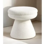 Adjustable velvet mushroom ottoman in a modern living room setting, plush round seat with wooden legs